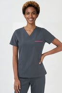 Model wearing Deep Slate ST247 Scrub Top in a studio setting, three-quarter view