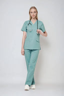 Model wearing Vintage Mint Avison Scrub Top by Good Uniform, full front view