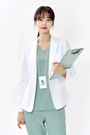 Model wearing Tiffany Mint ST002 Scrub Top with medical jacket, three-quarter view