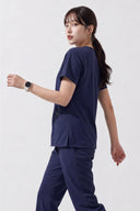 Side and back fit of the Royal Purple ST215 Scrub Top by Good Uniform