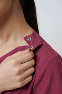 Neckline and shoulder details on the Dusty Rose ST247 Scrub Top