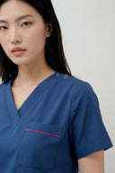 Pocket, neckline and shoulder details on the Methyl Blue ST247 Scrub Top