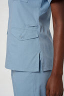 Side pocket details on the Soft Blue Avison Scrub Top