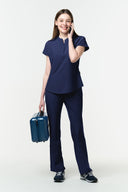Warm Navy CST202 Scrub Top shown during movement to demonstrate fit and flexibility
