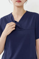 Neckline and button details on the Royal Purple ST215 Scrub Top