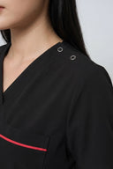 Pocket, neckline and seam details on the Black ST247 Scrub Top