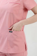 Pocket details on the Indi Pink ST247 Scrub Top
