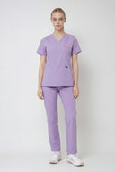 Model wearing Lavandula ST247 Scrub Top by Good Uniform, full front view