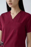 Pocket, neckline and shoulder details on the Rosé Wine Avison Scrub Top