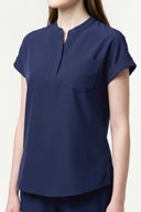 Pocket, neckline and seam details on the Warm Navy CST202 Scrub Top
