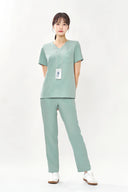 Model wearing Tiffany Mint ST002 Scrub Top by Good Uniform, full front view