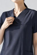 Neckline and button details on the Navy ST215 Scrub Top