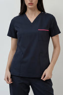 Pocket, neckline and seam details on the Navy ST247 Scrub Top