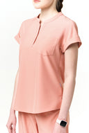 Side fit of the Coral Peach CST202 Scrub Top by Good Uniform