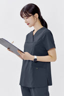 Side fit of the Cool Grey ST215 Scrub Top by Good Uniform