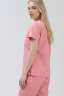 Side and back fit of the Indi Pink ST247 Scrub Top by Good Uniform