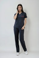 Model wearing Navy ST247 Scrub Top by Good Uniform, full front view