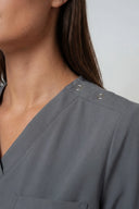 Neckline and shoulder details on the Smoky Grey ST247 Scrub Top