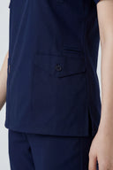 Pocket and slit details on the Modern Navy Avison Scrub Top