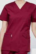 Pocket, neckline and seam details on the Rosé Wine Avison Scrub Top