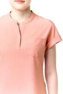 Pocket, neckline and seam details on the Coral Peach CST202 Scrub Top
