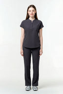 Model wearing Grey CST202 Scrub Top by Good Uniform, full front view