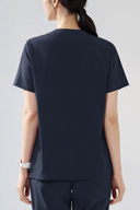 Back fit of the Navy ST215 Scrub Top by Good Uniform