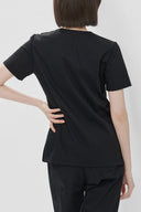 Back fit of the Black Avison Scrub Top by Good Uniform three-quarter view