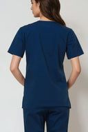 back fit of the Matte Blue Avison Scrub Top by Good Uniform in three-quarter view