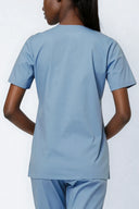 Back fit of the Soft Blue Avison Scrub Top by Good Uniform in a three-quarter shot