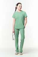 Model wearing Smoke Mint CST201 Scrub Top by Good Uniform, full front view