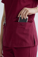 Pocket details on the Rosé Wine Avison Scrub Top showing its functionality