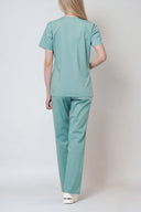 Back fit of the Vintage Mint Avison Scrub Top by Good Uniform in full shot from the back